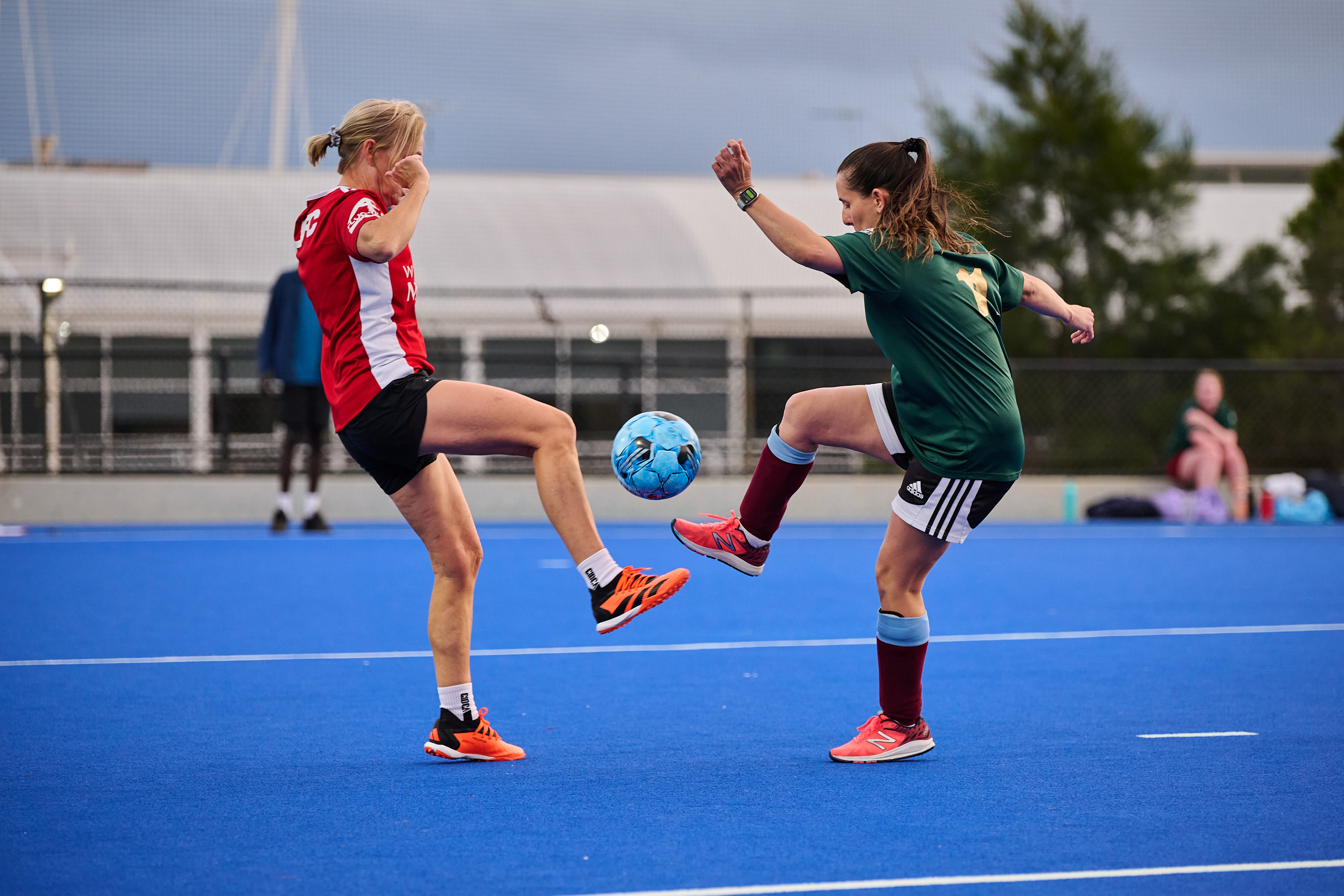 Two female soccer players competing