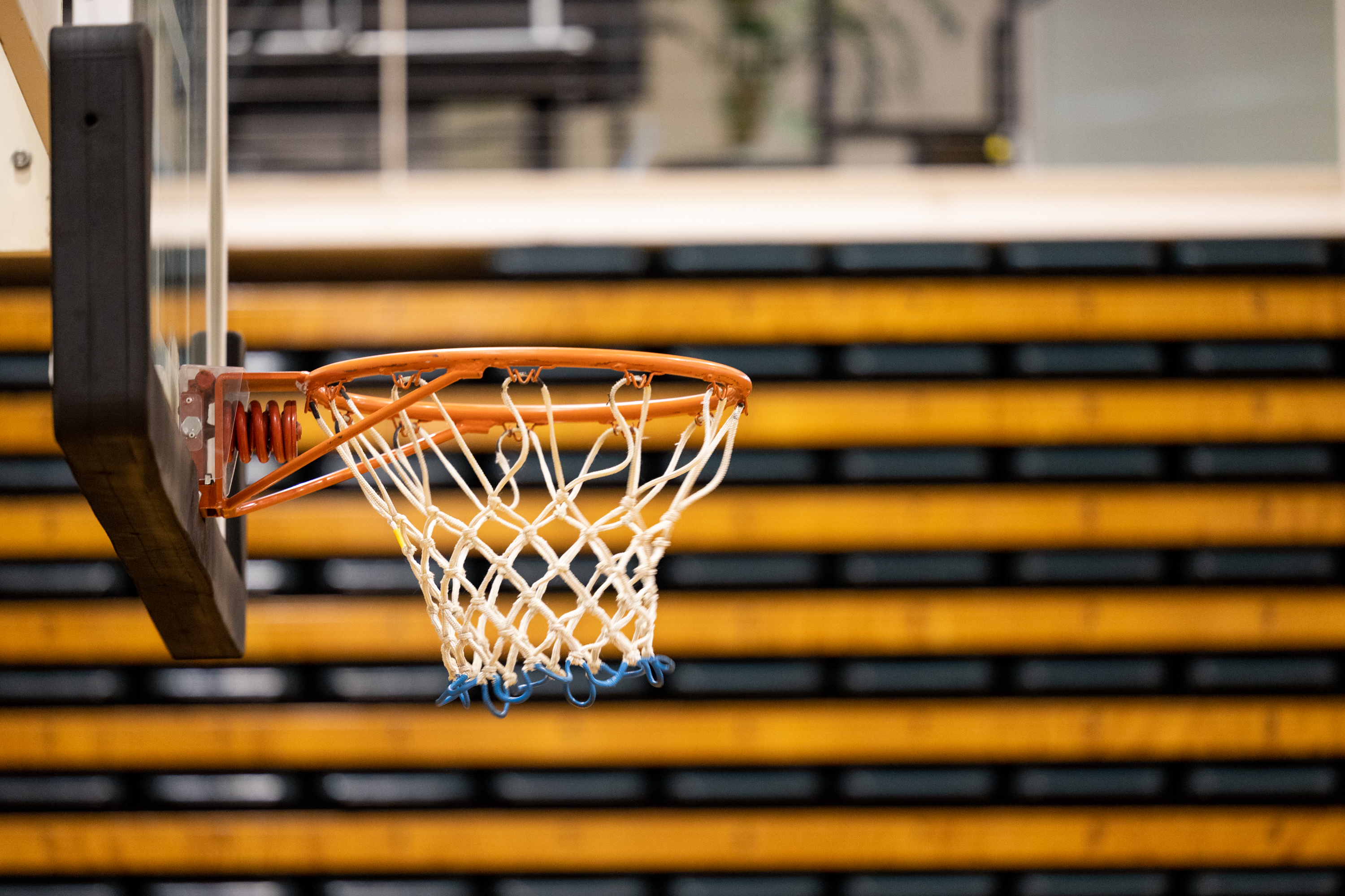 A close up photo of a basketball hoop attached to a backboard